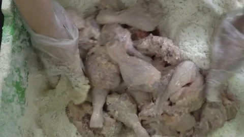 The process of cooking fried chicken with flour, crispy fried chicken. Stock Footage 233478633