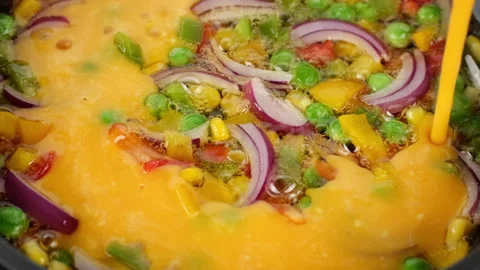 Process cooking frying omelette with vegetables in pan, close up Video stock 269207864