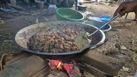 Process Cooking goat skin from close up in a pan Stock Footage 305030072