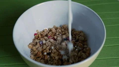 Process of cooking healthy dieting breakfast or snack.Slow motion milk pourin Stock Footage 152185418