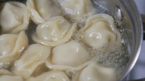 Process of cooking homemade dumplings.  View from above. Close-up. Stock Footage 106832970