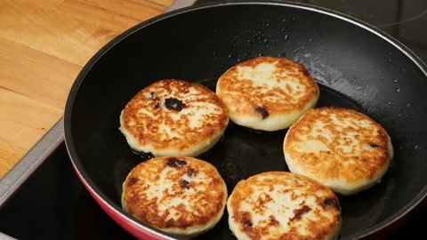 Process of cooking homemade food. Preparing healthy cottage cheese fritters Stock Footage 273674834