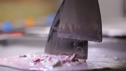 The process of cooking an ice cream roll in a freezer. Stock Footage 89445921