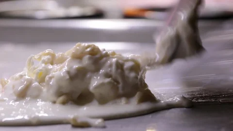 The process of cooking an ice cream roll in a freezer. Stock Footage 89447028
