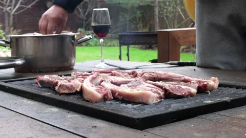 The process of cooking kebab on a table with a built-in barbecue, dinner outdoor 스톡 동영상 274176165