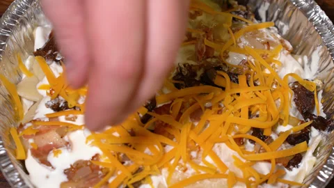The process of cooking lasagna in an alumen form, sprinkled with carrots Stock Footage 248984623