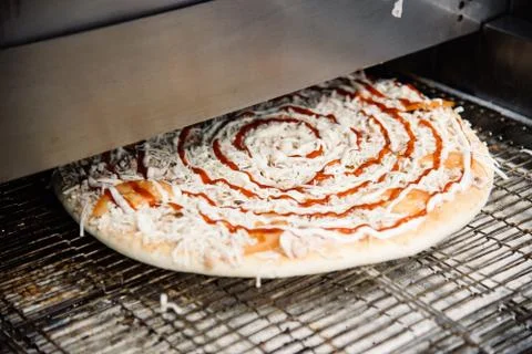 Process of cooking, making, baking pizza on grill. Close up. Restaurant, cafe Stock Photos