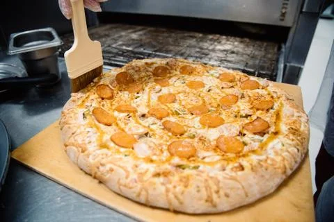 Process of cooking, making, baking pizza. Close up. Restaurant, cafe or pizze Stock Photos