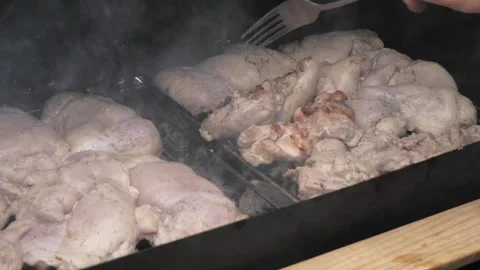 The process of cooking meat on coals. Stock Footage 275571489