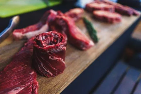 Process of cooking meat on the grill close-up. Stock Photos
