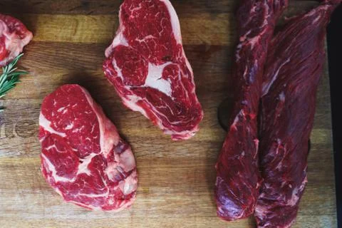 Process of cooking meat on the grill close-up. Stock Photos
