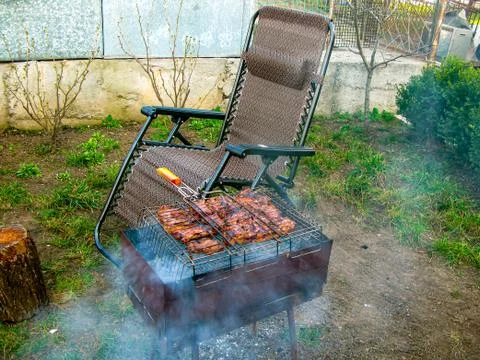 The process of cooking meat on the grill Stock Photos
