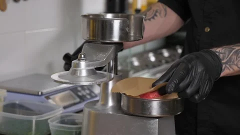 The process of cooking meat patties for a burger with a special burger press. Stock Footage 342702220