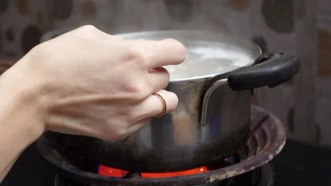 The process of cooking meat soup with various spices and vegetables Stock Footage 298444466