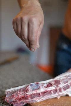 The process of cooking meat with vegetables wrapped in foil, on the grill at  Stock Photos