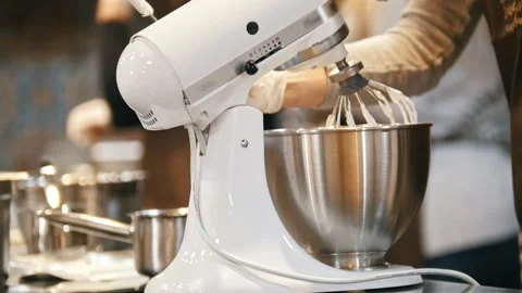 Process of cooking meringue whipped egg whites on mixer whisk Stock Footage 326850515