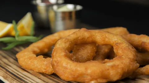 Process of cooking onion rings in beer batter recipe Stock Footage 91543853