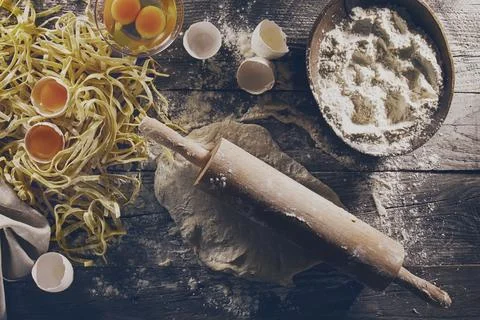Process of cooking pasta with raw fresh ingredients for classic italian foo.. Stock Photos