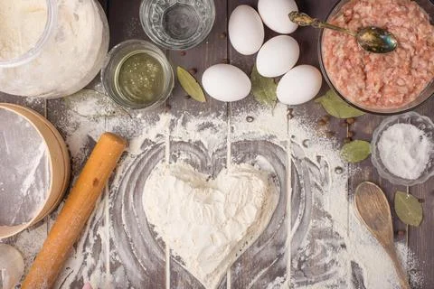 Process of cooking pelmeni with chef's hands, top view Stock Photos