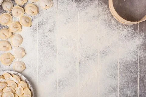 Process of cooking pelmeni with chef's hands, top view Stock Photos