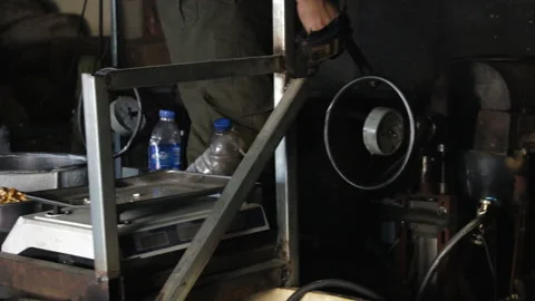 The process of cooking popcorn and popped rice. Outdated technology using old Stock Footage 101280978