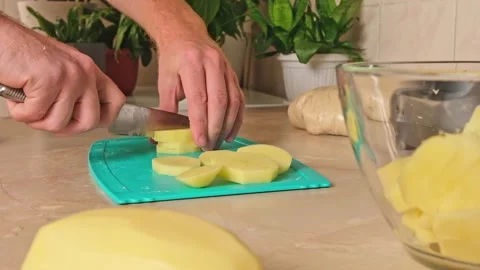 Process of cooking potatoes rustic. Slicing potatoes. Mix spices, oil. Bake on Stock Footage 244720200