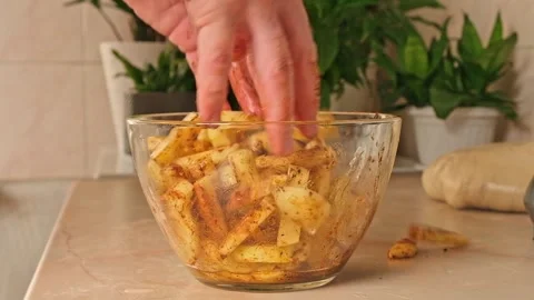Process of cooking potatoes rustic. Slicing potatoes. Mix spices, oil. Bake on Stock Footage 244720777