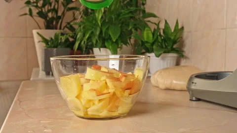 Process of cooking potatoes rustic. Slicing potatoes. Mix spices, oil. Bake on Stock Footage 244803879
