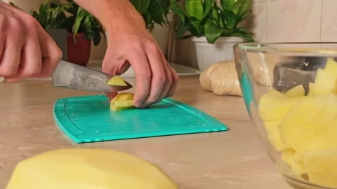 Process of cooking potatoes rustic. Slicing potatoes. Mix spices, oil. Bake on Stock Footage 244803960