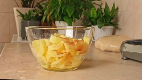 Process of cooking potatoes rustic. Slicing potatoes. Mix spices, oil. Bake on Stock Footage 245657299