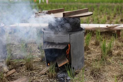 The process of cooking rice in a pot. Stock Photos