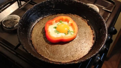 Process of cooking roasted eggs in red pepper Stock Footage 76022122