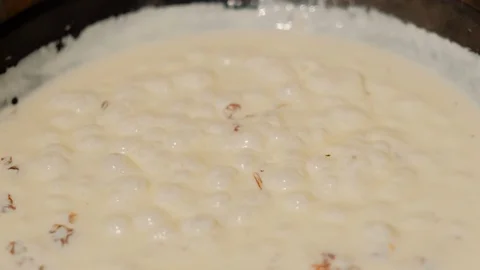 The process of cooking sauce with dried tomatoes for pasta in a pan Stock Footage 126644737