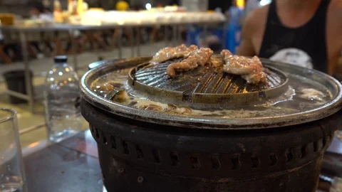 The process of cooking seafood on the brazier. Special grill and pan. Stock Footage 106894861