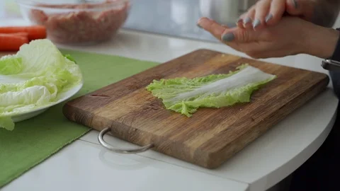 Process of cooking stuffed cabbage rolls with meat and rice. Video stock 102176260