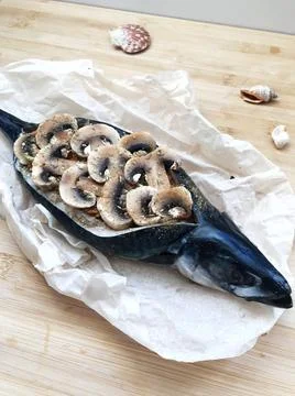 The process of cooking stuffed mackerel with vegetables, mushrooms and spices Stock Photos