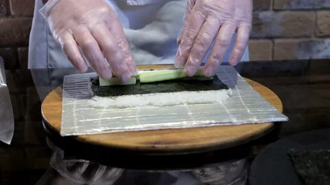 The process of cooking sushi maki, rice rolls. Delicious Japanese food. Stock Footage 132412466