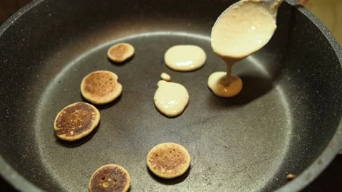 Process of cooking tiny pancake cereal - trendy quarantine food. 動画素材 131106578