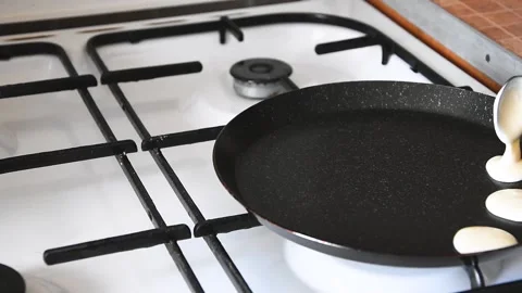 Process of cooking tiny pancake cereal - trendy quarantine food. Dough is poured 動画素材 134793908