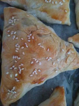 The process of cooking triangular meat pies, top sprinkled with 스톡 사진