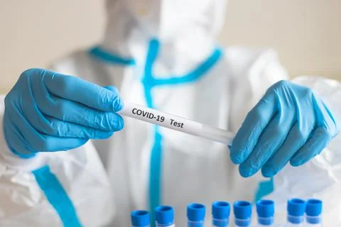 Process of coronavirus PCR antigen testing examination by nurse medic in labo Stock Photos