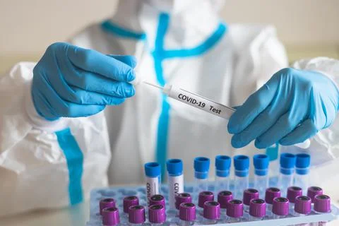 Process of coronavirus PCR antigen testing examination by nurse medic in labo Stock Photos