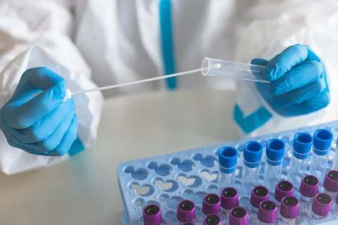 Process of coronavirus PCR antigen testing examination by nurse medic in labo Stock Photos