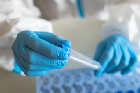 Process of coronavirus PCR antigen testing examination by nurse medic in labo Stock Photos