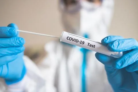 Process of coronavirus PCR antigen testing examination by nurse medic in labo Stock Photos