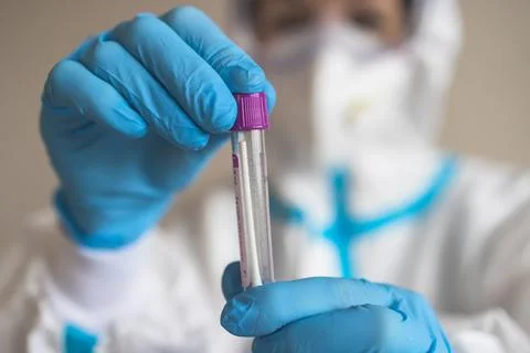 Process of coronavirus PCR antigen testing examination by nurse medic in labo Stock Photos