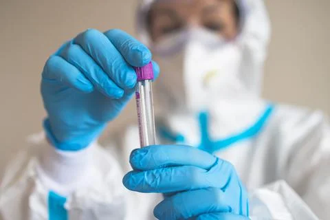 Process of coronavirus PCR antigen testing examination by nurse medic in labo Stock Photos