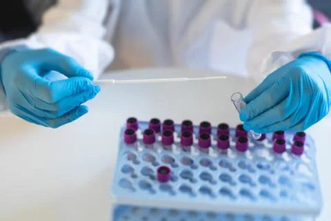 Process of coronavirus testing examination by nurse medic in laboratory lab,  Stock Photos