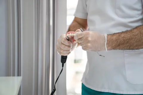 The process of correction of the denture, Stock Photos