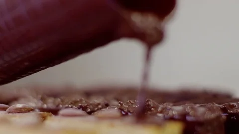 The process of covering cakes with chocolate glaze Stock Footage 72255363